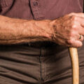 Man walking with cane.