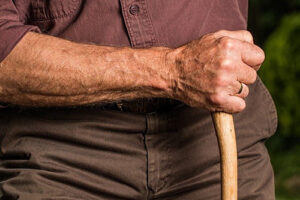 Man walking with cane.